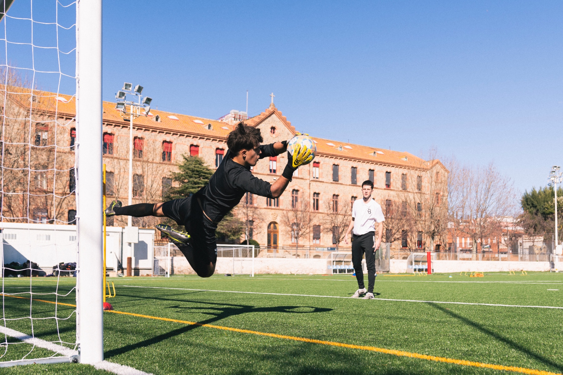 Goalkeeper making a diving save during training